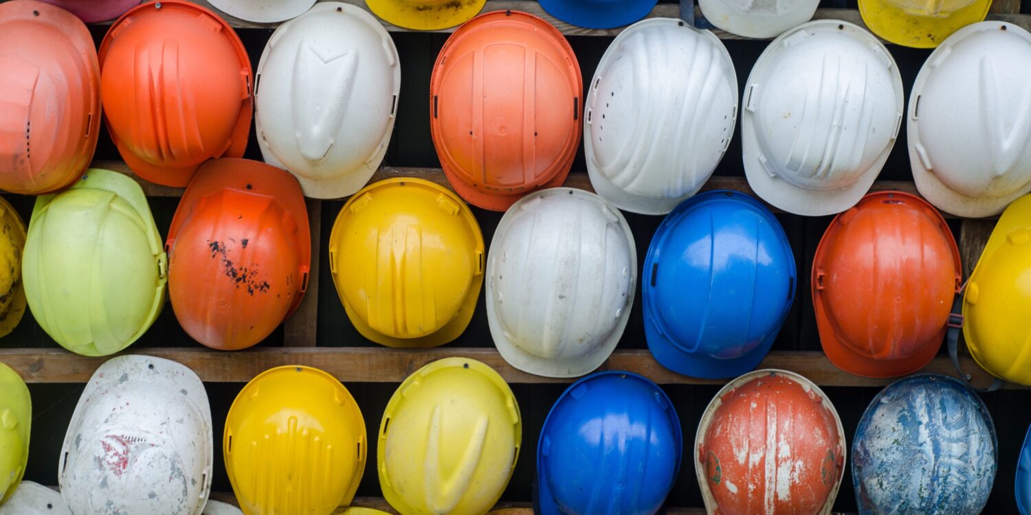 A colourful collection of hard hats.